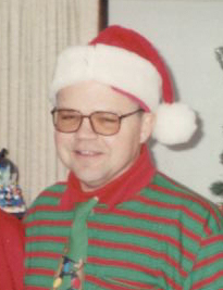 Mike dressed up as an elf for Christmas